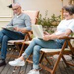 Adult couple is using laptop in RV Park