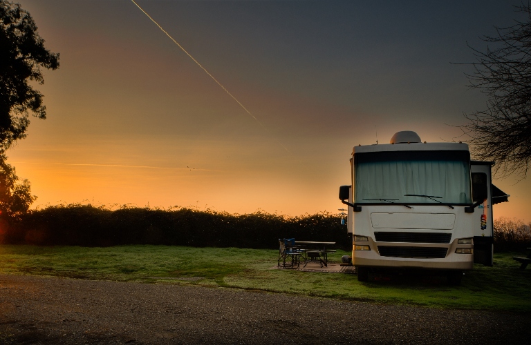 Rv motor home parked at campsite
